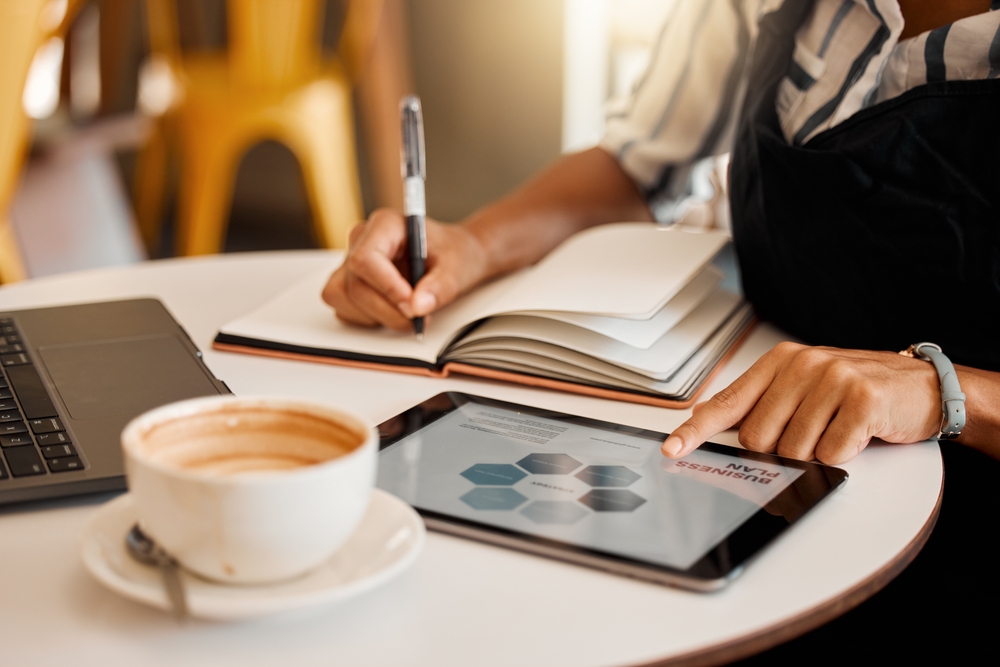 Marketing,,Planning,Or,Innovation,Strategy,On,Tablet,In,Cafe,,Coffee